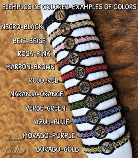 several bracelets of different colors with different symbols engraved in wood