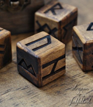wooden die engraved with Viking runes