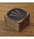 Small dark wooden box carved and engraved with the Celtic symbol of Awen and metal clasp.