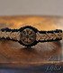 Macramé bracelet with a wooden centrepiece, laser-engraved with the Vegvisir symbol, the Viking compass