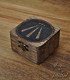 Small dark wooden box carved and engraved with the Celtic symbol of Awen and metal clasp.