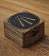 Small dark wooden box carved and engraved with the Celtic symbol of Awen and metal clasp.
