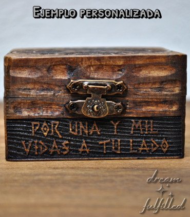 Front of wooden box engraved with personalized text under the closure.