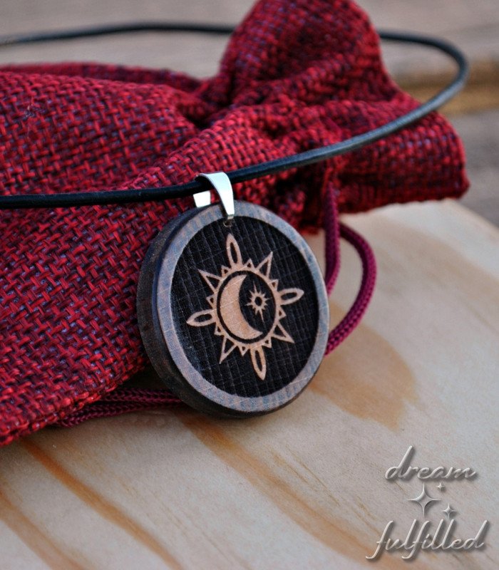 Wooden pendant engraved with Sun, Moon and Star