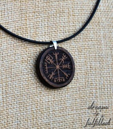 Vegvisir pendant on natural fabric background