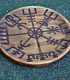 large wooden plate engraved with the Viking symbol of guidance, the Vegvisir