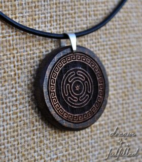 Detail of the engraving on the wooden pendant