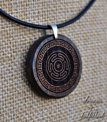 Detail of the engraving on the wooden pendant