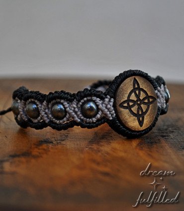 Witch’s Knot bracelet with hematite beads on wood